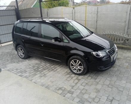 Черный Фольксваген Туран, объемом двигателя 1.4 л и пробегом 218 тыс. км за 6500 $, фото 1 на Automoto.ua