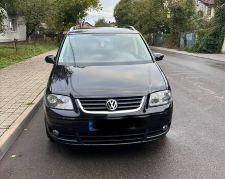 Черный Фольксваген Туран, объемом двигателя 1.6 л и пробегом 207 тыс. км за 7000 $, фото 1 на Automoto.ua