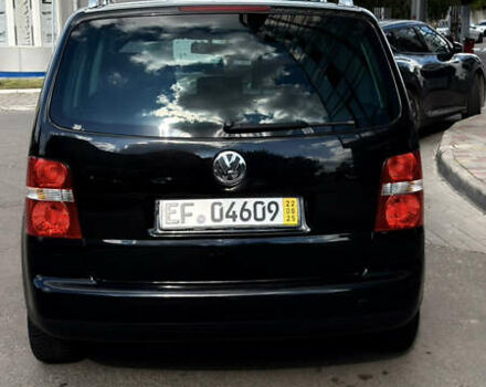 Черный Фольксваген Туран, объемом двигателя 1.6 л и пробегом 190 тыс. км за 6999 $, фото 74 на Automoto.ua