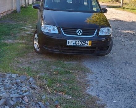 Черный Фольксваген Туран, объемом двигателя 1.6 л и пробегом 238 тыс. км за 5900 $, фото 1 на Automoto.ua