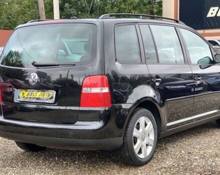 Черный Фольксваген Туран, объемом двигателя 1.6 л и пробегом 289 тыс. км за 5800 $, фото 5 на Automoto.ua