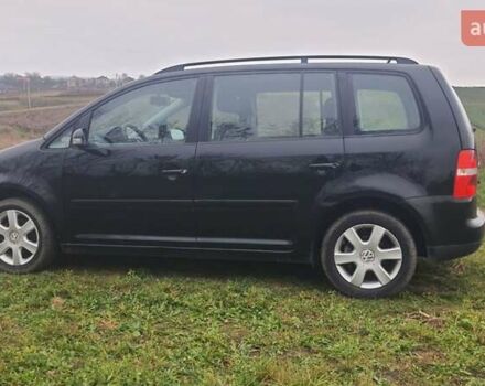 Черный Фольксваген Туран, объемом двигателя 1.6 л и пробегом 200 тыс. км за 5500 $, фото 5 на Automoto.ua