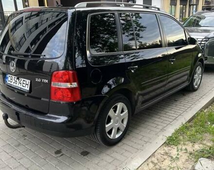 Черный Фольксваген Туран, объемом двигателя 1.97 л и пробегом 292 тыс. км за 6500 $, фото 2 на Automoto.ua