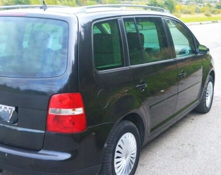 Черный Фольксваген Туран, объемом двигателя 2 л и пробегом 400 тыс. км за 3300 $, фото 1 на Automoto.ua