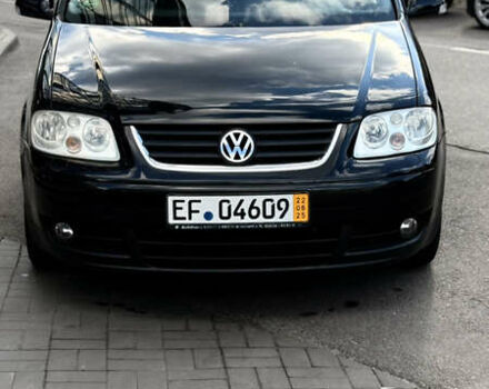 Черный Фольксваген Туран, объемом двигателя 1.6 л и пробегом 190 тыс. км за 6999 $, фото 64 на Automoto.ua