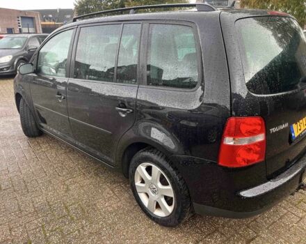 Черный Фольксваген Туран, объемом двигателя 1.6 л и пробегом 280 тыс. км за 6500 $, фото 2 на Automoto.ua