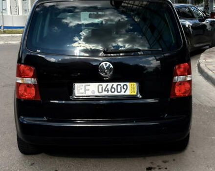 Черный Фольксваген Туран, объемом двигателя 1.6 л и пробегом 190 тыс. км за 6999 $, фото 73 на Automoto.ua