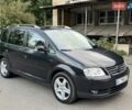 Черный Фольксваген Туран, объемом двигателя 1.97 л и пробегом 240 тыс. км за 6500 $, фото 1 на Automoto.ua