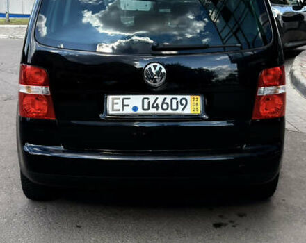 Черный Фольксваген Туран, объемом двигателя 1.6 л и пробегом 190 тыс. км за 6999 $, фото 62 на Automoto.ua