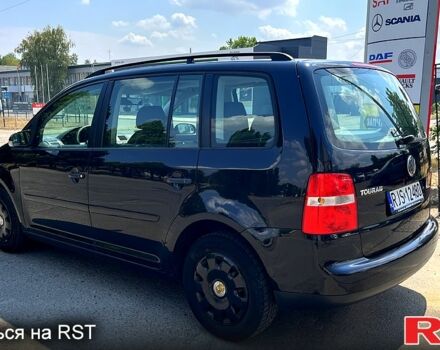 Черный Фольксваген Туран, объемом двигателя 1.4 л и пробегом 293 тыс. км за 3400 $, фото 2 на Automoto.ua