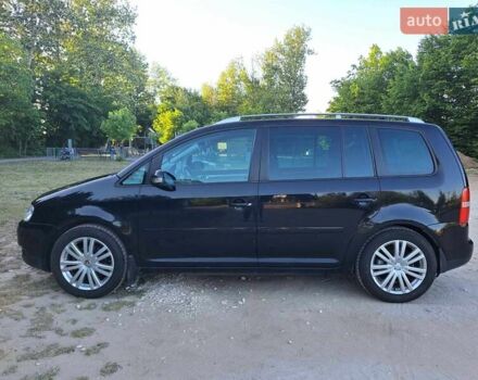 Чорний Фольксваген Туран, об'ємом двигуна 1.97 л та пробігом 291 тис. км за 7000 $, фото 1 на Automoto.ua