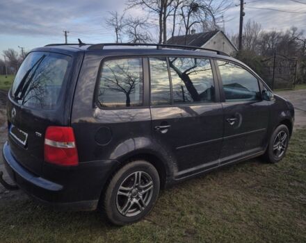 Черный Фольксваген Туран, объемом двигателя 1.9 л и пробегом 217 тыс. км за 2550 $, фото 2 на Automoto.ua