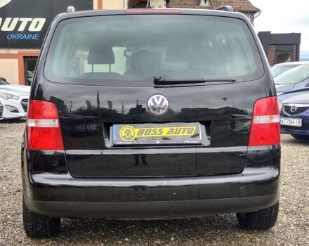 Черный Фольксваген Туран, объемом двигателя 1.6 л и пробегом 289 тыс. км за 5800 $, фото 4 на Automoto.ua