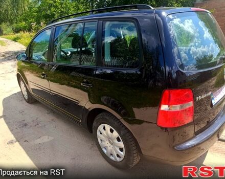 Черный Фольксваген Туран, объемом двигателя 1.6 л и пробегом 223 тыс. км за 5900 $, фото 3 на Automoto.ua