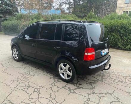 Чорний Фольксваген Туран, об'ємом двигуна 1.9 л та пробігом 290 тис. км за 6500 $, фото 5 на Automoto.ua