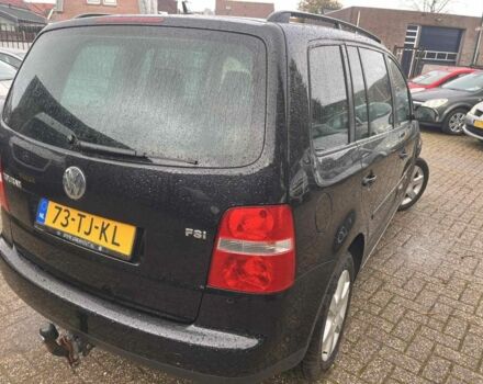 Черный Фольксваген Туран, объемом двигателя 1.6 л и пробегом 280 тыс. км за 6500 $, фото 1 на Automoto.ua