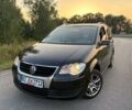 Чорний Фольксваген Туран, об'ємом двигуна 2 л та пробігом 200 тис. км за 1499 $, фото 1 на Automoto.ua