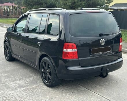 Черный Фольксваген Туран, объемом двигателя 2 л и пробегом 111 тыс. км за 4000 $, фото 2 на Automoto.ua