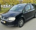 Черный Фольксваген Туран, объемом двигателя 1.9 л и пробегом 290 тыс. км за 360 $, фото 1 на Automoto.ua