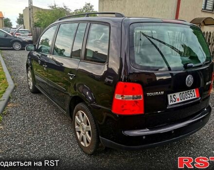 Черный Фольксваген Туран, объемом двигателя 2 л и пробегом 211 тыс. км за 2200 $, фото 2 на Automoto.ua