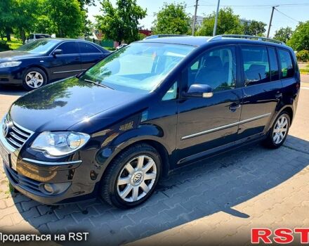 Черный Фольксваген Туран, объемом двигателя 1.4 л и пробегом 290 тыс. км за 5100 $, фото 4 на Automoto.ua