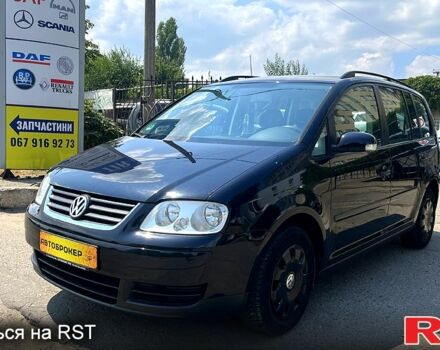 Черный Фольксваген Туран, объемом двигателя 1.4 л и пробегом 293 тыс. км за 3400 $, фото 1 на Automoto.ua