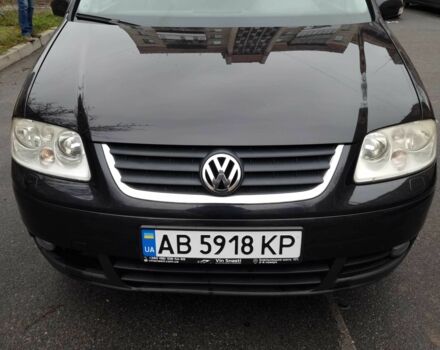 Черный Фольксваген Туран, объемом двигателя 1.4 л и пробегом 239 тыс. км за 5700 $, фото 1 на Automoto.ua