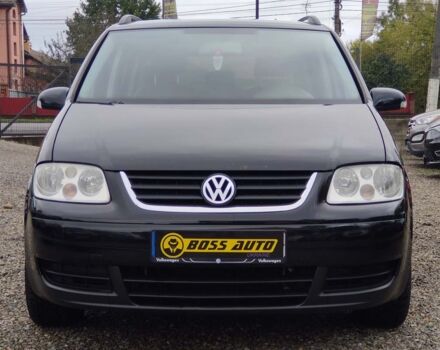 Черный Фольксваген Туран, объемом двигателя 1.6 л и пробегом 289 тыс. км за 5800 $, фото 1 на Automoto.ua