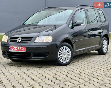 Черный Фольксваген Туран, объемом двигателя 1.6 л и пробегом 249 тыс. км за 5999 $, фото 4 на Automoto.ua