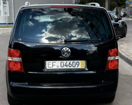 Черный Фольксваген Туран, объемом двигателя 1.6 л и пробегом 190 тыс. км за 6999 $, фото 1 на Automoto.ua