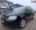 Черный Фольксваген Туран, объемом двигателя 1.6 л и пробегом 186 тыс. км за 5999 $, фото 1 на Automoto.ua