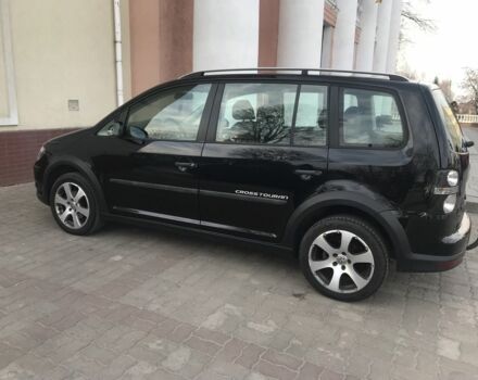 Черный Фольксваген Туран, объемом двигателя 1.4 л и пробегом 260 тыс. км за 6500 $, фото 1 на Automoto.ua