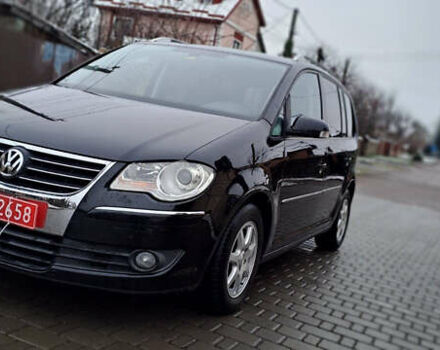 Черный Фольксваген Туран, объемом двигателя 1.4 л и пробегом 193 тыс. км за 6950 $, фото 6 на Automoto.ua