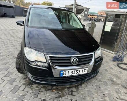 Чорний Фольксваген Туран, об'ємом двигуна 1.97 л та пробігом 313 тис. км за 7500 $, фото 1 на Automoto.ua