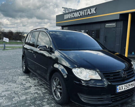 Черный Фольксваген Туран, объемом двигателя 1.39 л и пробегом 242 тыс. км за 7500 $, фото 1 на Automoto.ua