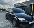 Черный Фольксваген Туран, объемом двигателя 1.39 л и пробегом 242 тыс. км за 7500 $, фото 1 на Automoto.ua