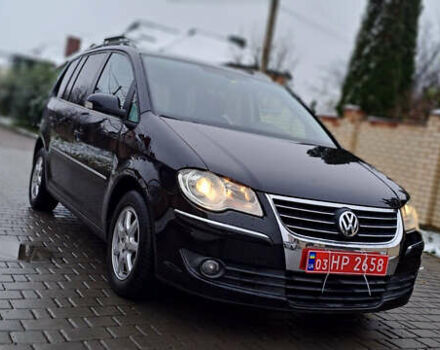 Черный Фольксваген Туран, объемом двигателя 1.4 л и пробегом 193 тыс. км за 6950 $, фото 2 на Automoto.ua