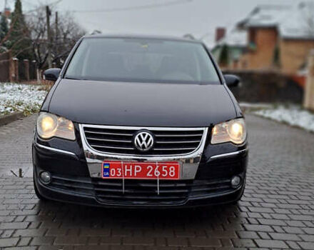 Черный Фольксваген Туран, объемом двигателя 1.4 л и пробегом 193 тыс. км за 6950 $, фото 1 на Automoto.ua