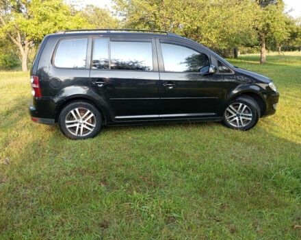 Черный Фольксваген Туран, объемом двигателя 1.9 л и пробегом 290 тыс. км за 7400 $, фото 2 на Automoto.ua