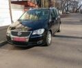 Черный Фольксваген Туран, объемом двигателя 1.4 л и пробегом 193 тыс. км за 6650 $, фото 1 на Automoto.ua