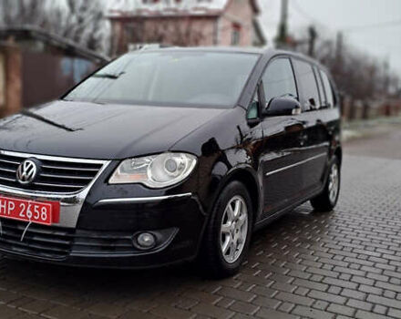Черный Фольксваген Туран, объемом двигателя 1.4 л и пробегом 193 тыс. км за 6950 $, фото 29 на Automoto.ua