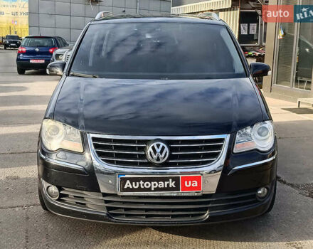 Черный Фольксваген Туран, объемом двигателя 2 л и пробегом 260 тыс. км за 9390 $, фото 1 на Automoto.ua