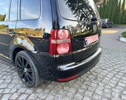 Черный Фольксваген Туран, объемом двигателя 1.4 л и пробегом 200 тыс. км за 7300 $, фото 1 на Automoto.ua