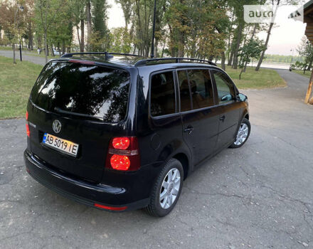 Черный Фольксваген Туран, объемом двигателя 1.6 л и пробегом 261 тыс. км за 7100 $, фото 1 на Automoto.ua