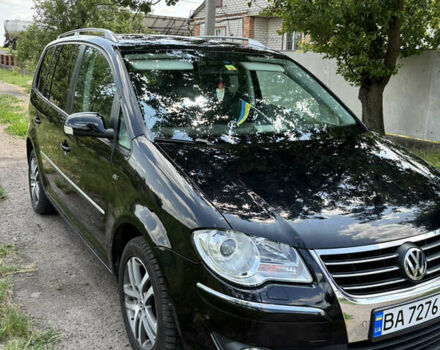 Черный Фольксваген Туран, объемом двигателя 1.39 л и пробегом 191 тыс. км за 8500 $, фото 2 на Automoto.ua