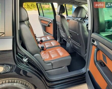 Черный Фольксваген Туран, объемом двигателя 1.6 л и пробегом 213 тыс. км за 8550 $, фото 159 на Automoto.ua