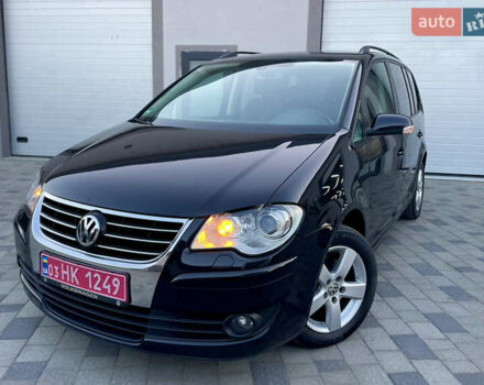 Чорний Фольксваген Туран, об'ємом двигуна 2 л та пробігом 292 тис. км за 8999 $, фото 1 на Automoto.ua