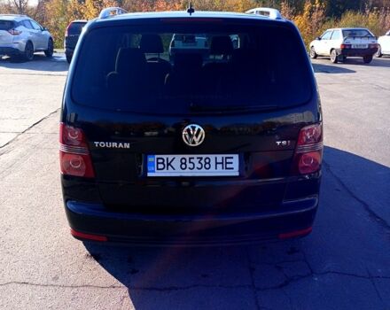 Черный Фольксваген Туран, объемом двигателя 1.4 л и пробегом 291 тыс. км за 6050 $, фото 2 на Automoto.ua