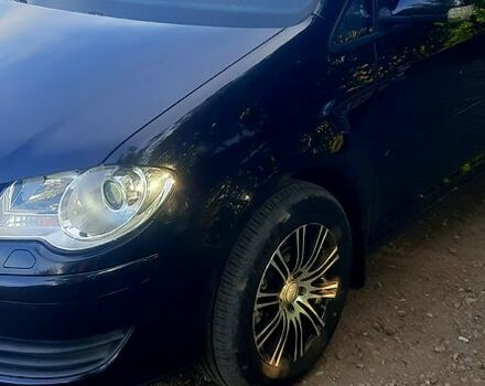 Черный Фольксваген Туран, объемом двигателя 1.4 л и пробегом 242 тыс. км за 7500 $, фото 2 на Automoto.ua