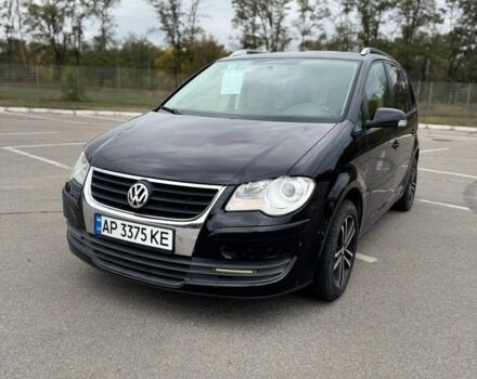 Черный Фольксваген Туран, объемом двигателя 1.4 л и пробегом 211 тыс. км за 7100 $, фото 2 на Automoto.ua